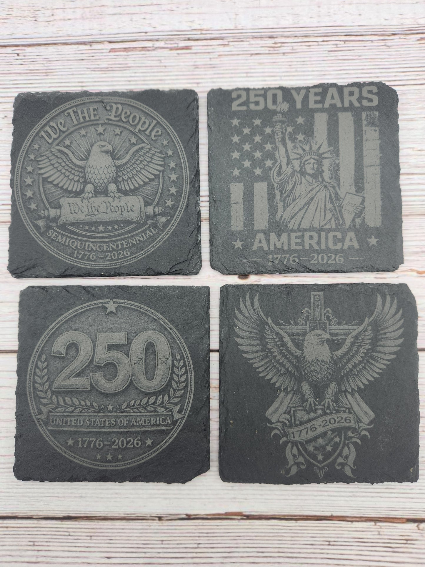 Celebrate America's 250th Anniversary with this engraved slate coaster set featuring four patriotic designs honoring the United States Semiquincentennial (1776–2026). These laser engraved natural slate coasters make perfect America 250 gifts, patriotic home décor, Fourth of July decorations, veteran gifts, military family gifts, and commemorative keepsakes.

Ideal for home bars, offices, man caves, patriotic celebrations, and collectors looking to commemorate this historic milestone.